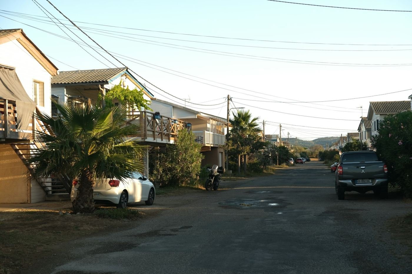 Residential street with parked cars in Umm Salal, Qatar